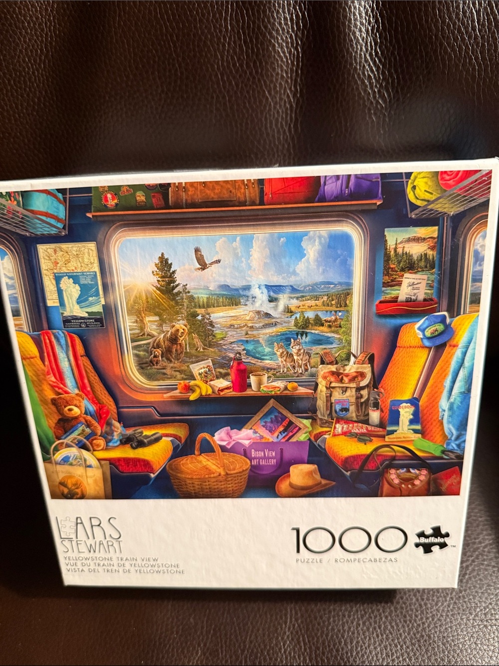 Lars Stewart the Yellowstone Train View 1000-piece jigsaw puzzle with poster.